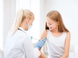 doctor doing vaccine to child